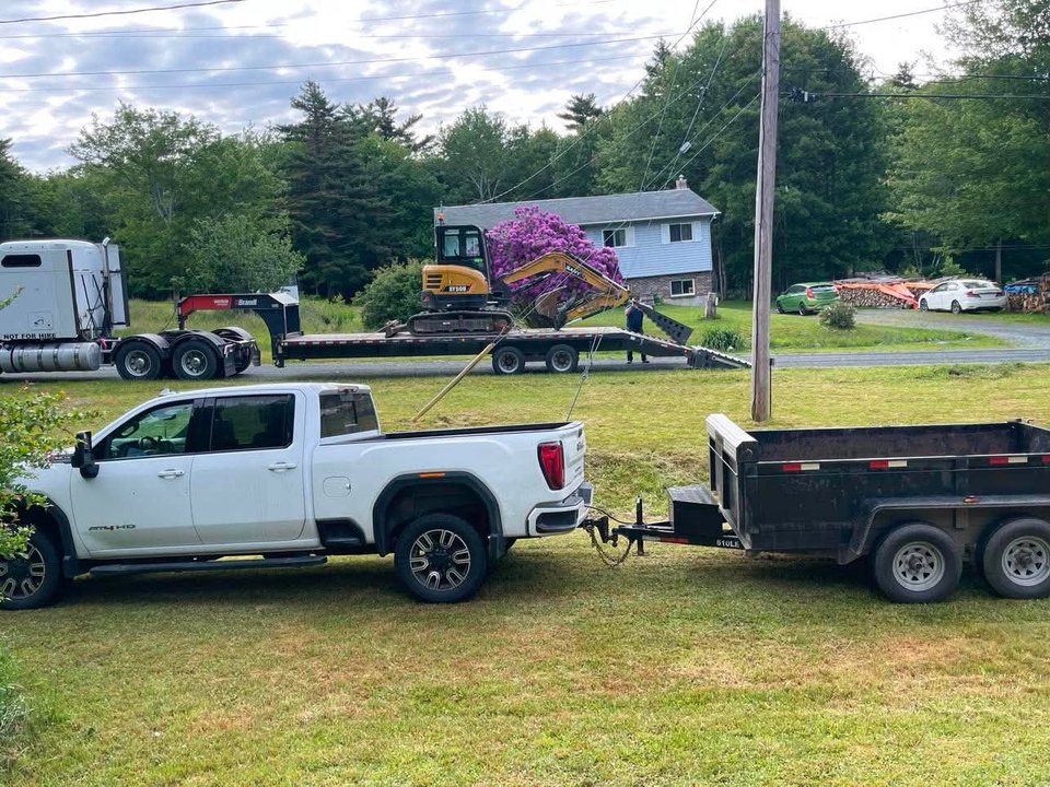 Excavator transported to a job site